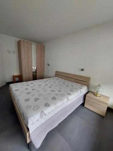 a bedroom with a large bed in a room at Haus Fortuna in Leukerbad