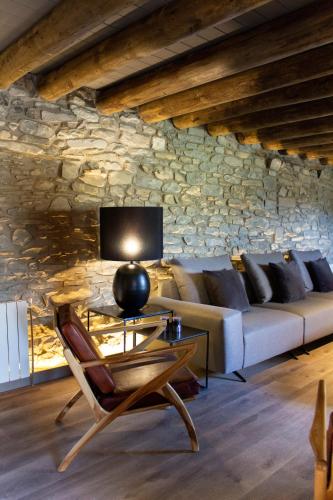 a living room with a couch and a table at Casa Rural Aracanciás in Borrastre