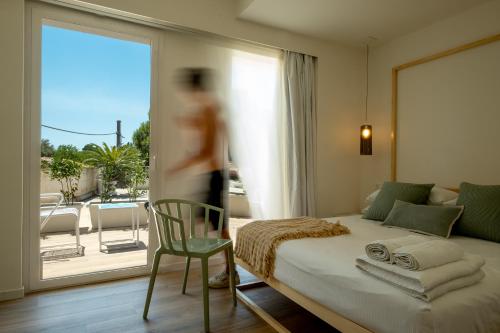 A bed or beds in a room at La Sirena Rooms