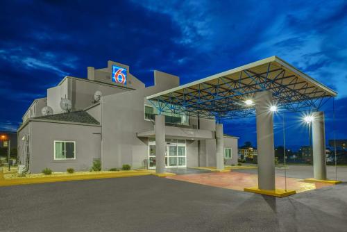 a building with a sign on the side of it at Motel 6-Montgomery, AL - Airport in Hope Hull