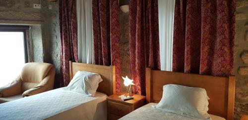 En eller flere senge i et værelse på Casa Bento Moura Portugal