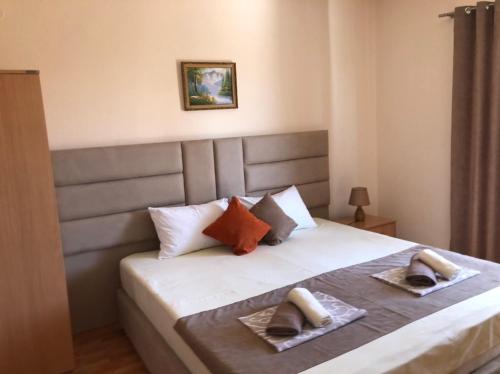 Postel nebo postele na pokoji v ubytování Moonlight Apartments
