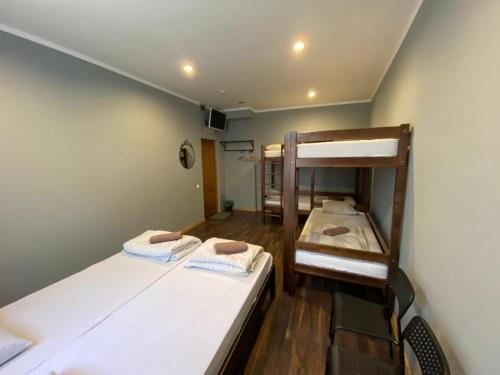 a room with two bunk beds in a room at ApartHotel Riga in Rīga