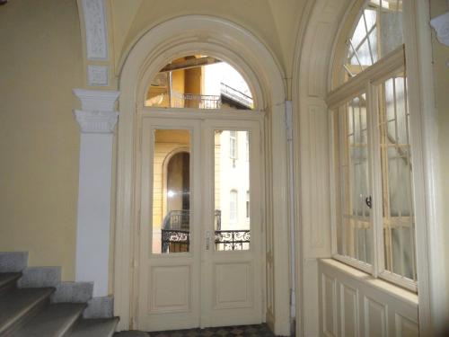 an entrance to a building with a white door at Boudoir Budapest Apartment in Budapest