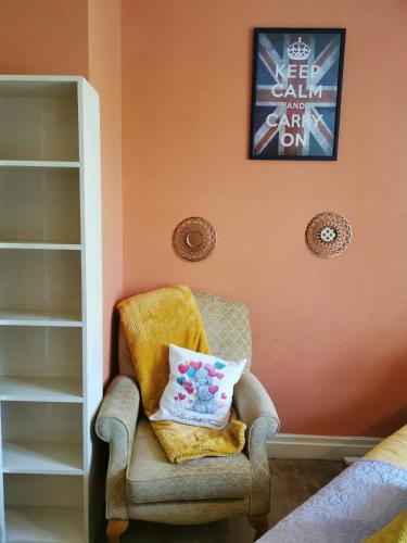 a chair with a pillow on it in a room at PEACEFUL RETREAT HIDEAWAY SURREY in Esher