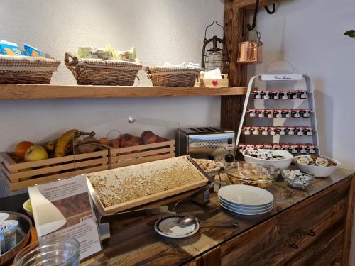 a counter with some food and other items on it at Hotel Signal in Macugnaga