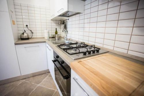 a kitchen with a stove and a counter top at SEA- ROOM-E in Ladispoli