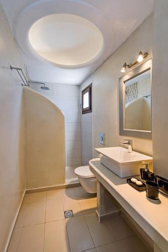 a bathroom with a sink and a toilet at Ifestos Villa in Fira