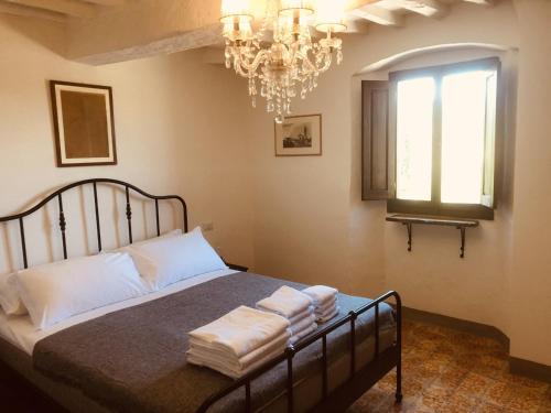 A bed or beds in a room at MEA CASA Toscana