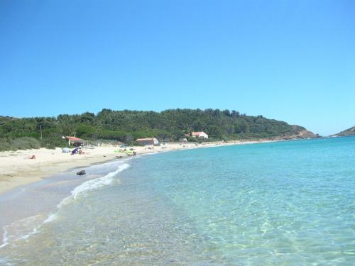 a beach with a bunch of people in the water at Luciana in La Croix-Valmer