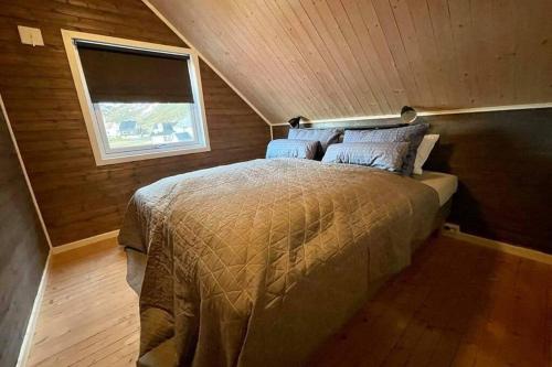 Un ou plusieurs lits dans un hébergement de l'établissement Lofoten_Beach_Eggum