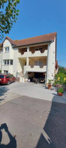 a building with a car parked in front of it at Casa Bita in Sibiu