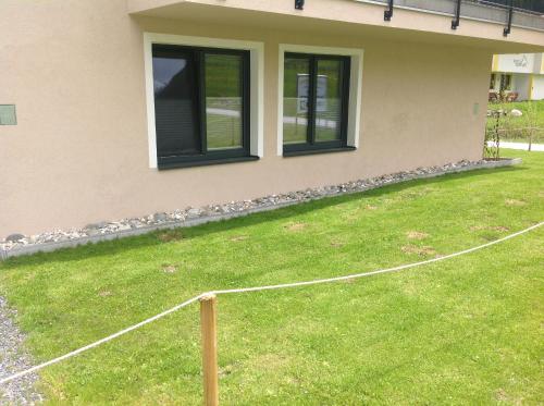 a house with a yard with a fence at fabienne - Silvretta Premium Card Betrieb in Galtür