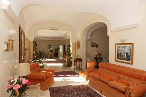 a living room filled with furniture and a large window at Torre Bennistra in Scopello