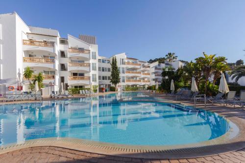 a large swimming pool in front of a building at Hotel La Pergola Mallorca in Port d'Andratx