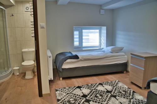 Tempat tidur dalam kamar di Jeleń Resort&Spa