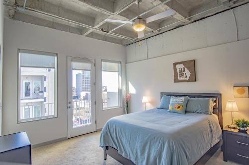 a bedroom with a bed and two windows at 2 Bedroom Fully Furnished Apartment near Emory University Hospital Midtown in Atlanta