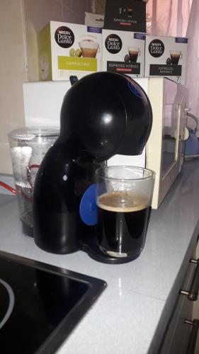 a coffee maker on a counter with a cup of coffee at Fabulosa, Casa Mudéjar. Centro Histórico. in Carmona