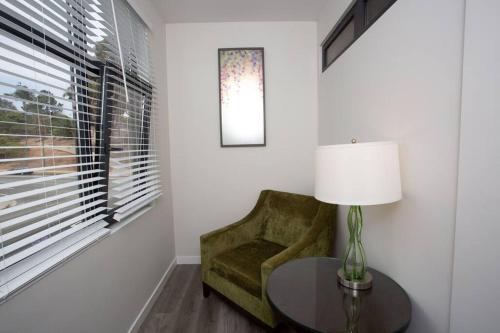 a room with a chair and a table and a window at Comfy Studio with Cali King Size Mattress in San Diego