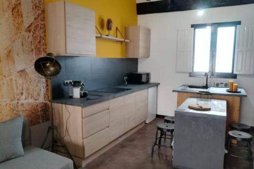 a kitchen with a sink and a counter top at Reus, amazing apartment in the city centre. in Reus