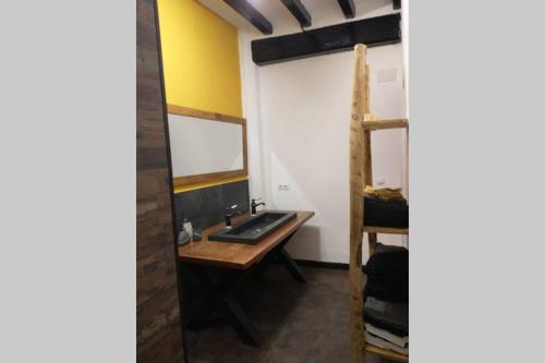 a bathroom with a sink and a bunk bed at Reus, amazing apartment in the city centre. in Reus