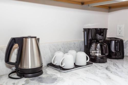 a counter top with a coffee maker and a coffee pot at 2 Bedroom, 2 Bathroom Detached Apt Max 7 Sleepers in San Diego