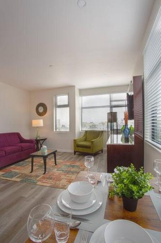 a living room with a table with wine glasses on it at One Bedroom Apartment with Luxurious Furnitures in San Diego
