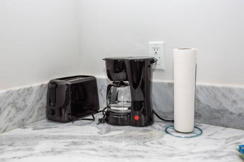 a kitchen counter with a blender and a paper roll at Cali King Size One Bedroom Luxurious Suite in DTSD in San Diego