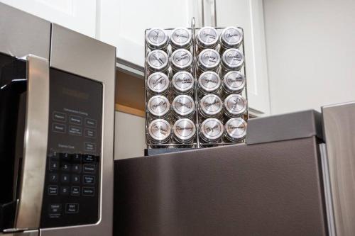a bunch of silver cups on top of a microwave at Spacious 1 Bedroom Apartment in Heart of San Diego in San Diego
