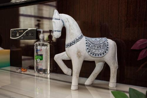 a plastic toy horse on a table next to a bottle at Spacious 1 Bedroom Apartment in Heart of San Diego in San Diego