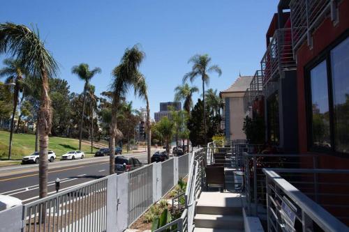 a view of a street with palm trees and a building at Spacious 500 sqft Studio with Balboa Park View in San Diego