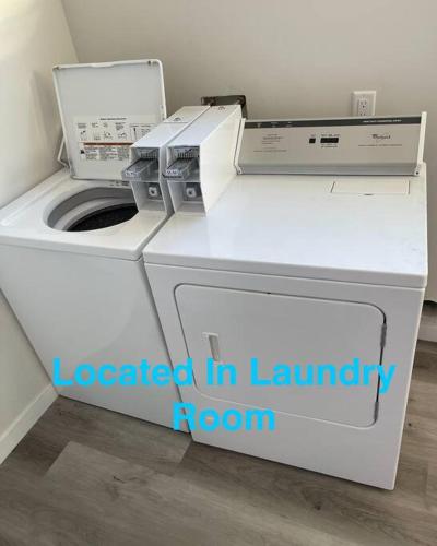 a white washer and dryer in a laundry room at Spacious 500 sqft Studio with Balboa Park View in San Diego