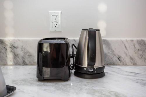 two toasters sitting on top of a kitchen counter at The Most Beautiful Bay View from 1 Bedroom Apt in San Diego