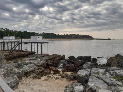 a dock on the shore of a body of water at Les Charmettes - SIBLU in Les Mathes