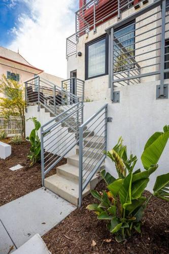 a staircase leading up to a house with a building at Luxurious One Bedroom Suite with Balboa Park View in San Diego