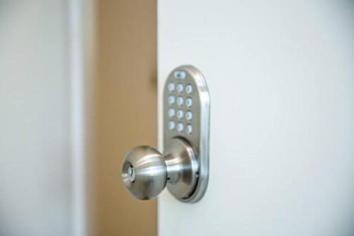 a door knob with a remote control on it at Luxurious One Bedroom Suite with Balboa Park View in San Diego