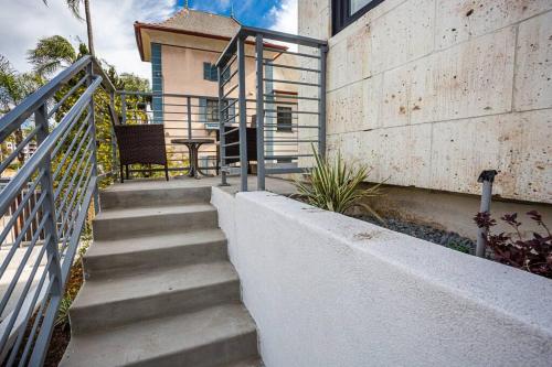 a set of stairs leading up to a house at Luxurious One Bedroom Suite with Balboa Park View in San Diego