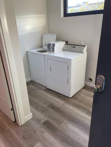 a washer and dryer in a room at Luxurious One Bedroom Suite with Balboa Park View in San Diego