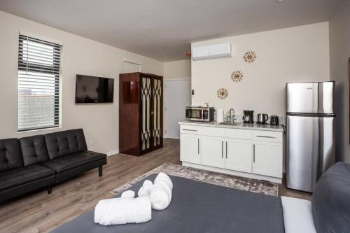 a living room with a couch and a kitchen at Studio with Beautiful View next to Downtown in San Diego