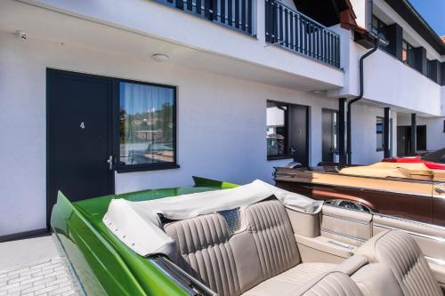a living room with a green and white couch at Motel Eldorado in Mikulov