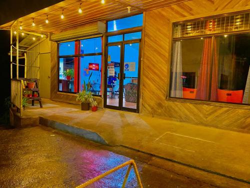 a building with windows with lights on it at Cabinas Selva Verde in Monteverde Costa Rica