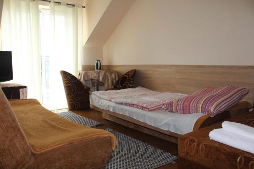 Tempat tidur dalam kamar di Turystyka Wiejska AGRO-DOM