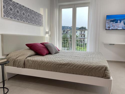 Кровать или кровати в номере Pianohome Sorrento