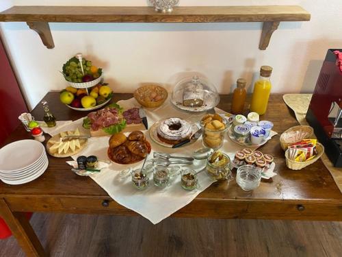 a table with many different types of food on it at La Magnolia in Greve in Chianti