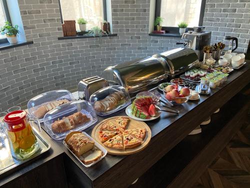 a buffet with many different types of food on a table at SB River Hotels in Atyraū