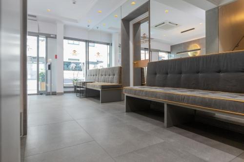 a waiting room with benches in a store at Hotel an der Oper in Munich