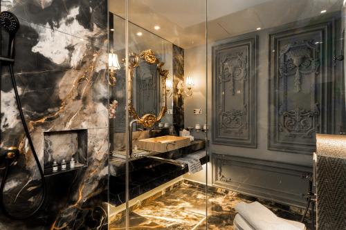 a bathroom with a glass shower and a sink at arte by Thomas Chan in Kuala Lumpur