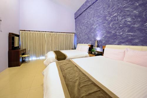 Katil atau katil-katil dalam bilik di Da Jen Shan Style Resort