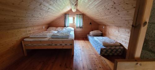 Tempat tidur dalam kamar di Hytte ved Gaularfjellet