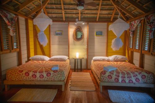 Postel nebo postele na pokoji v ubytování Aventura Rincon Ecolodge
